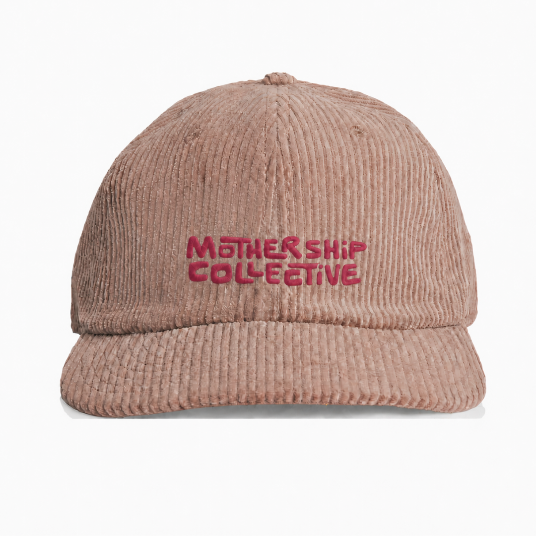 A dusty rose corduroy baseball cap with 'MOTHERSHIP COLLECTIVE' embroidered in pink on the front, shown against a plain white background.
